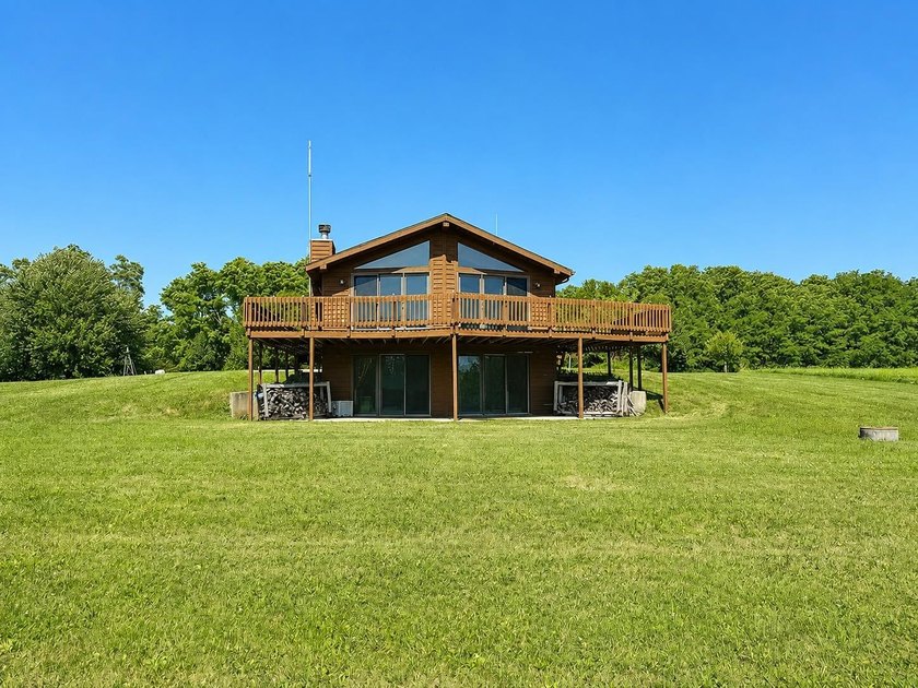 Nestled on 2.93 picturesque acres with a wooded backdrop, this - photo 3