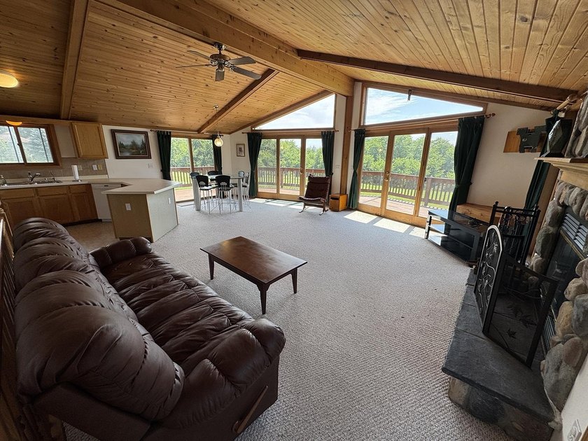 Nestled on 2.93 picturesque acres with a wooded backdrop, this - photo 8