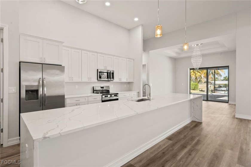 GULF ACCESS, POOL HOME! Custom built and completed in 2024, this - photo 3