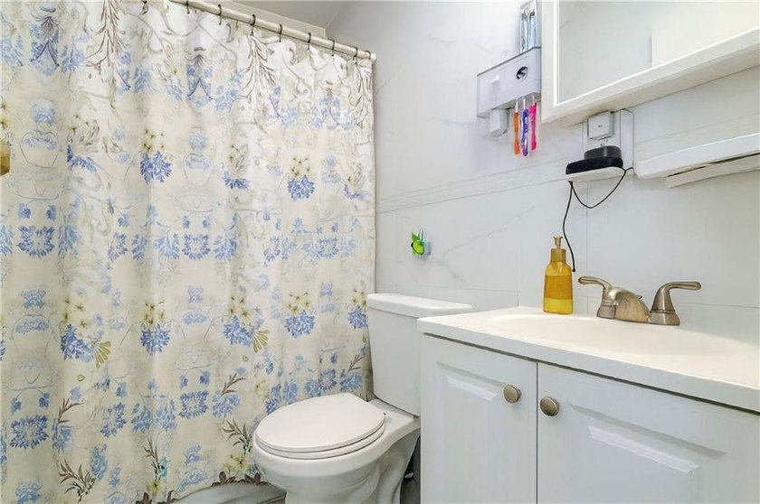 Introducing a distinguished three-family residence offering both - photo 12