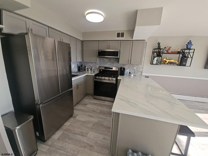 Experience elevated coastal living in this beautifully redone - photo 7