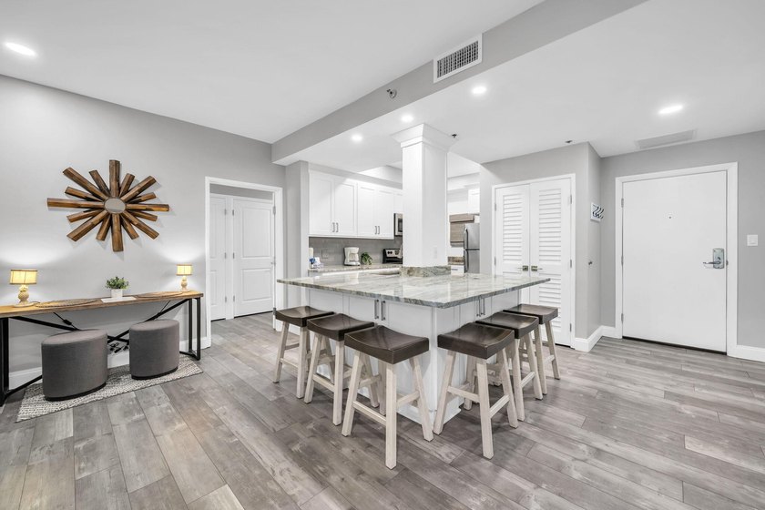 This gorgeous condo has been completely remodeled. Stunning open - photo 6