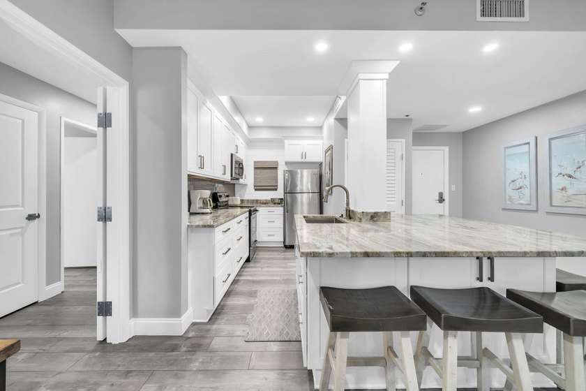 This gorgeous condo has been completely remodeled. Stunning open - photo 8