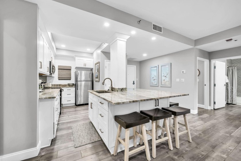 This gorgeous condo has been completely remodeled. Stunning open - photo 9