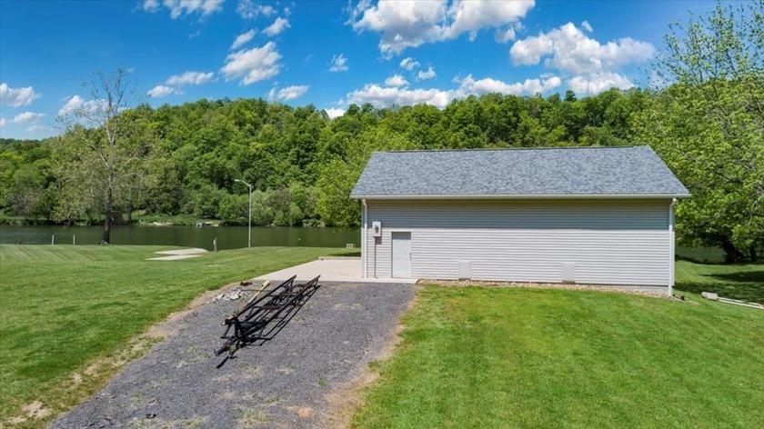 Enjoy nearly an acre of level waterfront property where the - photo 2