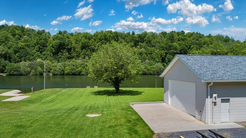 Enjoy nearly an acre of level waterfront property where the - photo 6