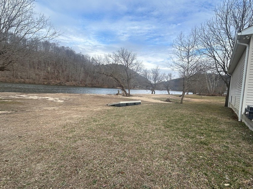Enjoy nearly an acre of level waterfront property where the - photo 9