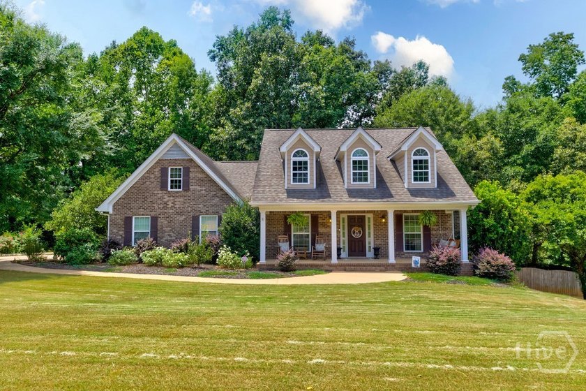 The classic brick &amp; siding exterior welcomes you with a - photo 46
