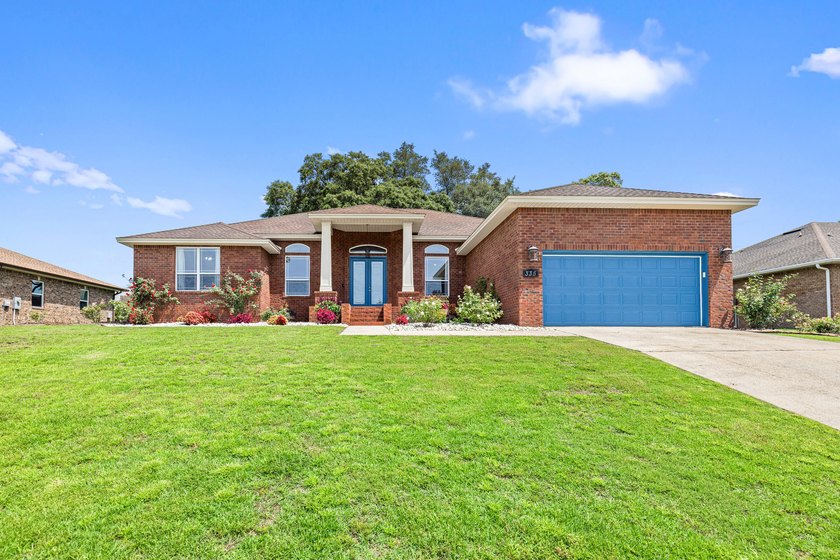 Before you reach the front door at 335 Grove Park Drive, the - photo 3