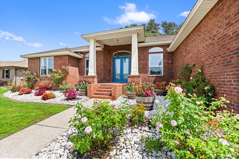 Before you reach the front door at 335 Grove Park Drive, the - photo 6