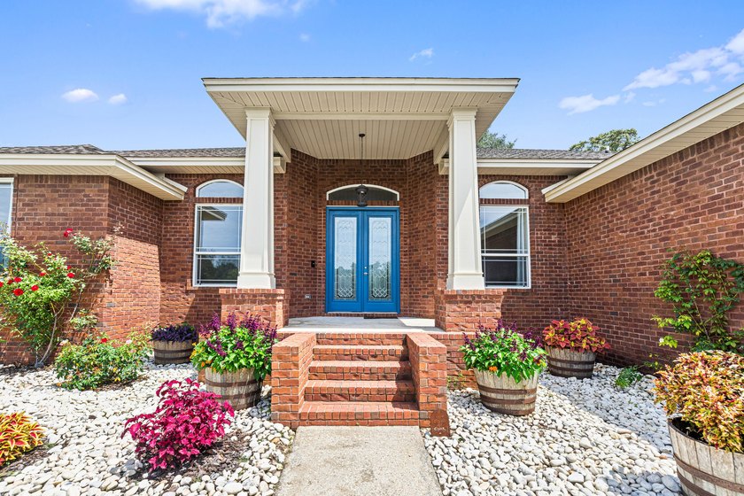 Before you reach the front door at 335 Grove Park Drive, the - photo 8