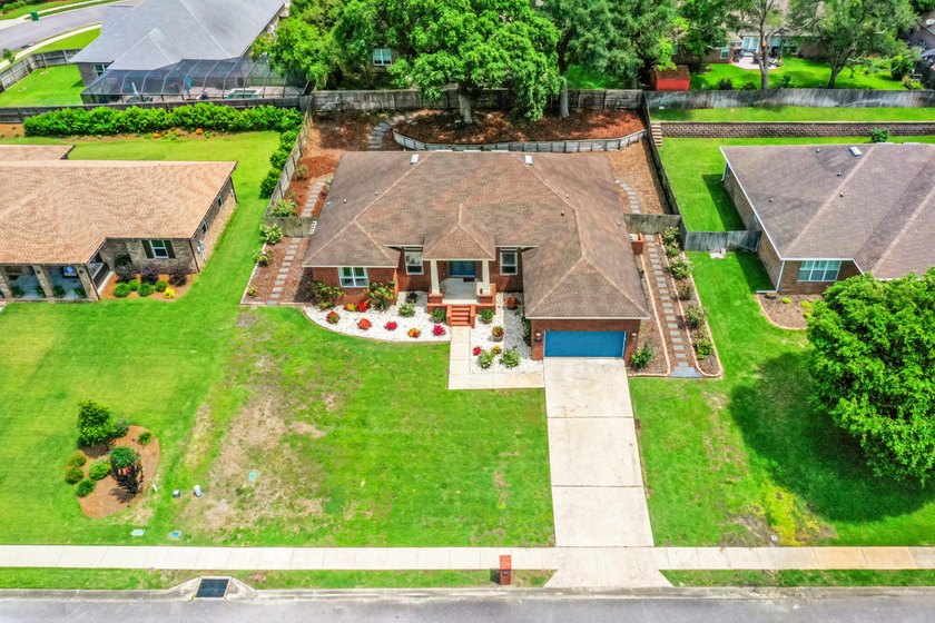Before you reach the front door at 335 Grove Park Drive, the - photo 10