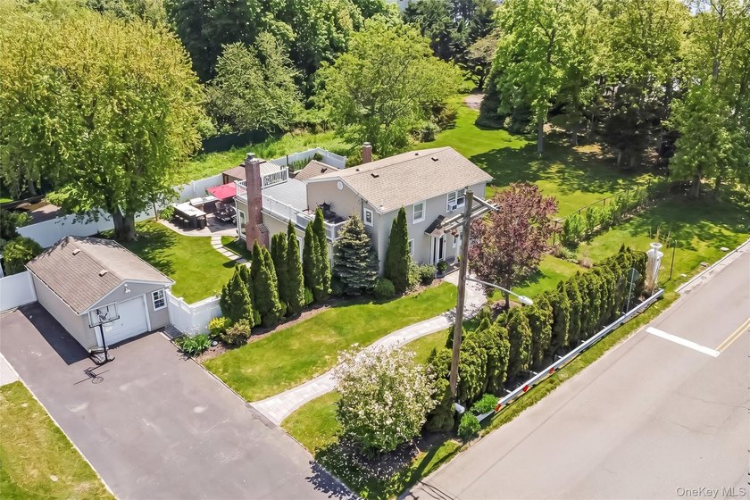 Welcome to this beautifully updated expanded Cape nestled in the - photo 2
