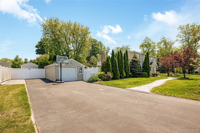 Welcome to this beautifully updated expanded Cape nestled in the - photo 3