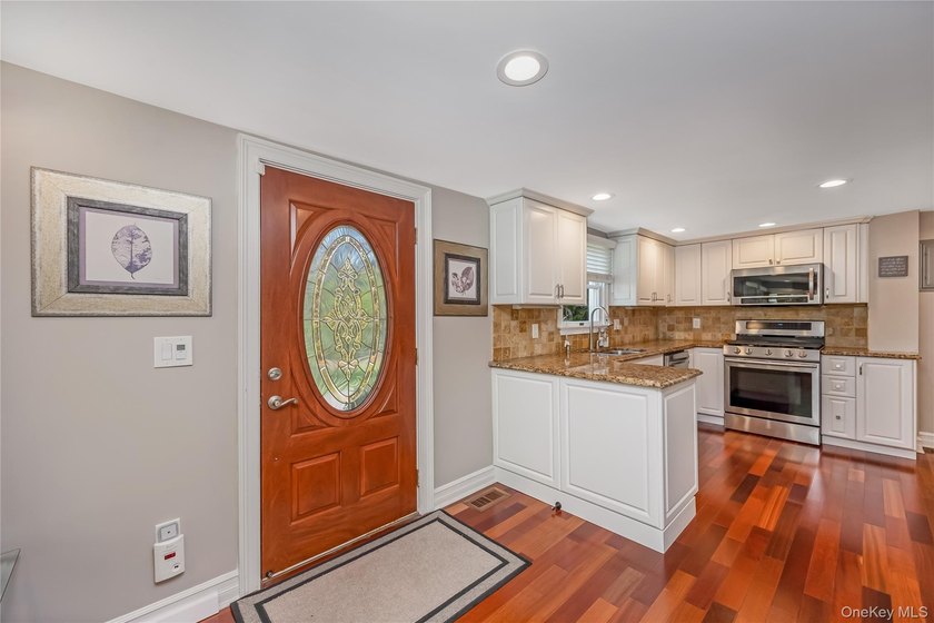 Welcome to this beautifully updated expanded Cape nestled in the - photo 4