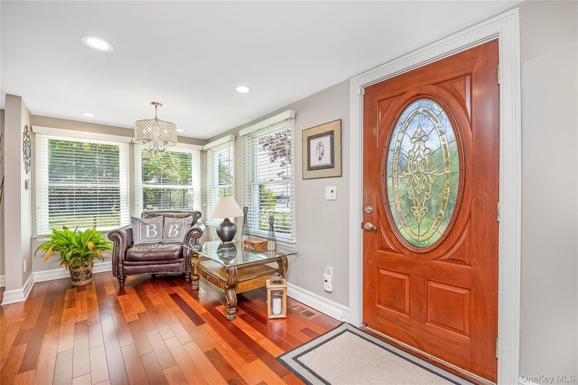 Welcome to this beautifully updated expanded Cape nestled in the - photo 5