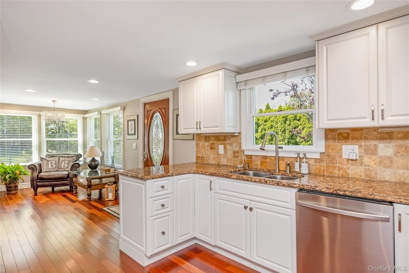 Welcome to this beautifully updated expanded Cape nestled in the - photo 6