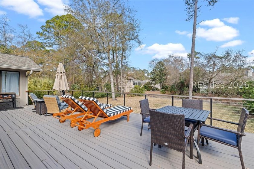 This beautifully updated residence offers laminate wood flooring - photo 2
