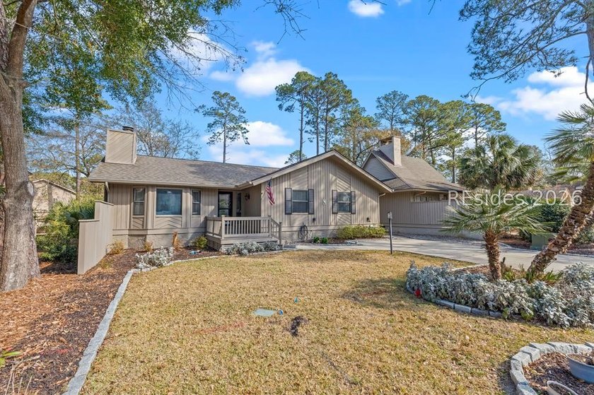 This beautifully updated residence offers laminate wood flooring - photo 3
