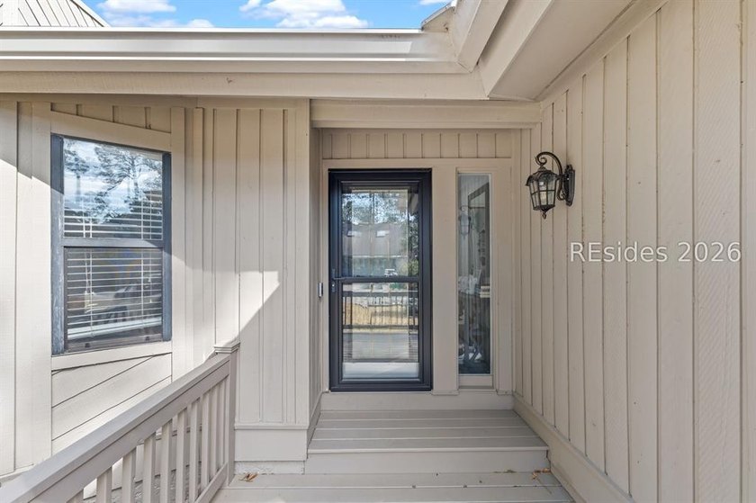 This beautifully updated residence offers laminate wood flooring - photo 5