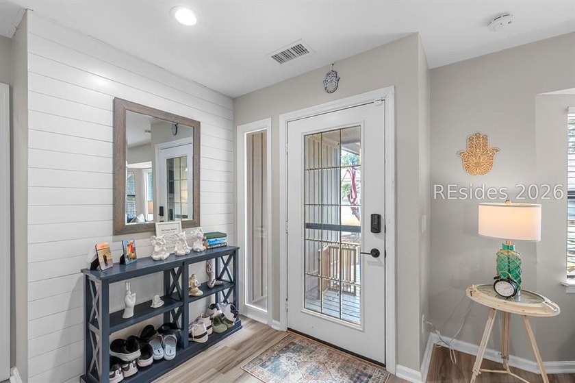 This beautifully updated residence offers laminate wood flooring - photo 6