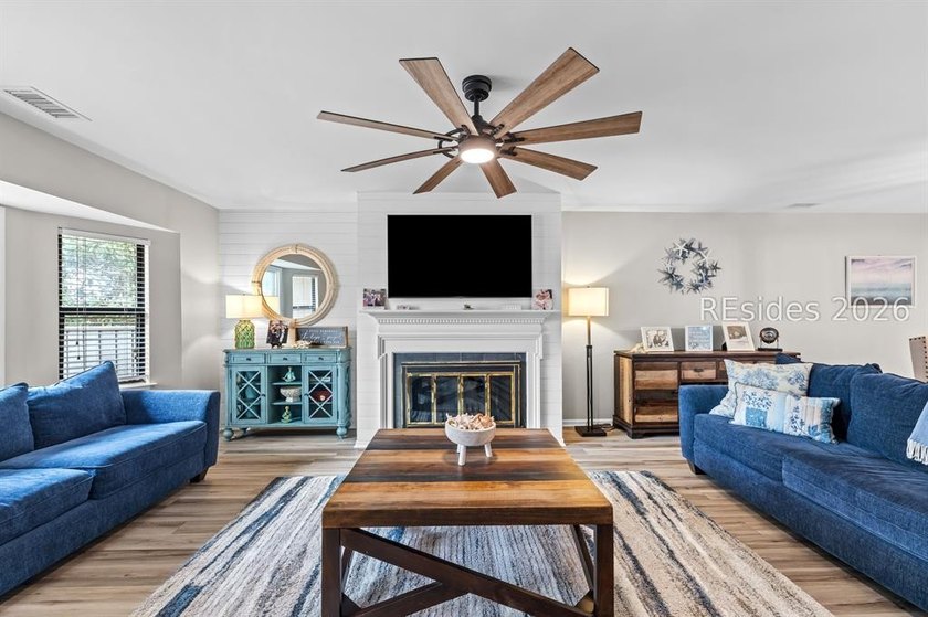 This beautifully updated residence offers laminate wood flooring - photo 8