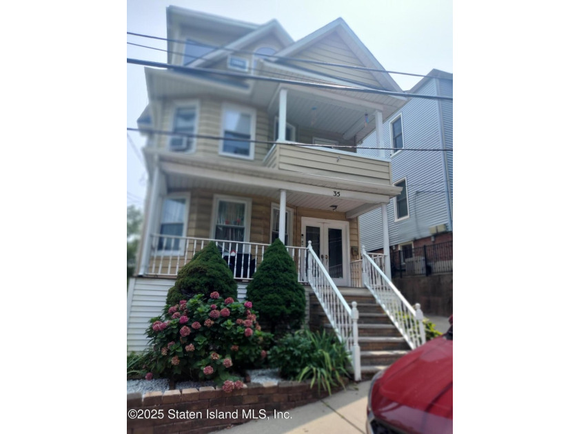THIS BEAUTIFULLY MAINTAINED 2 FAMILY DETACHED HOME ON ONE OF THE - photo 2
