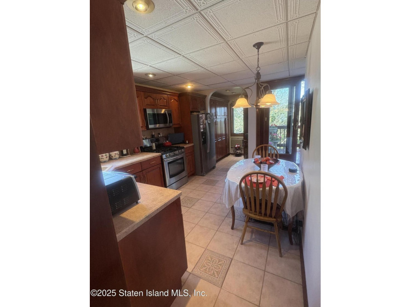 THIS BEAUTIFULLY MAINTAINED 2 FAMILY DETACHED HOME ON ONE OF THE - photo 8