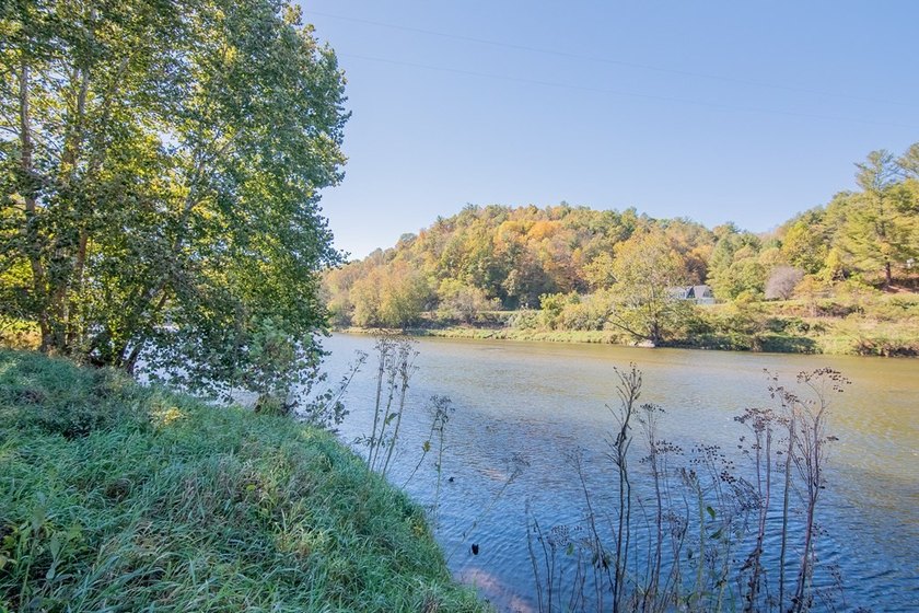 Experience the ultimate riverside retreat on this premier 5-acre - photo 7