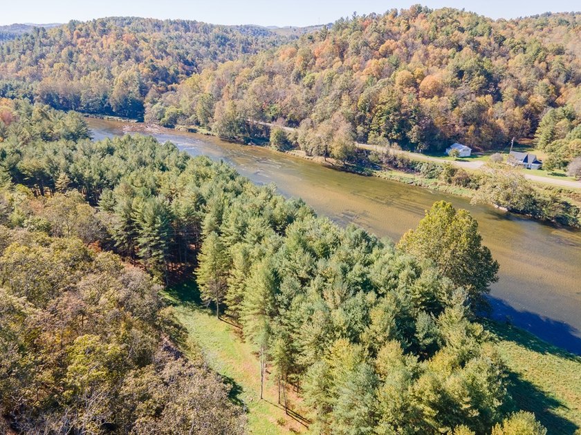 Experience the ultimate riverside retreat on this premier 5-acre - photo 9