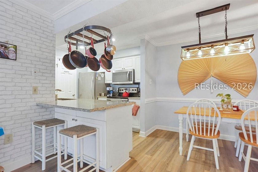 This first-floor 2BR/2BA villa in Palmetto Commons presents a - photo 5