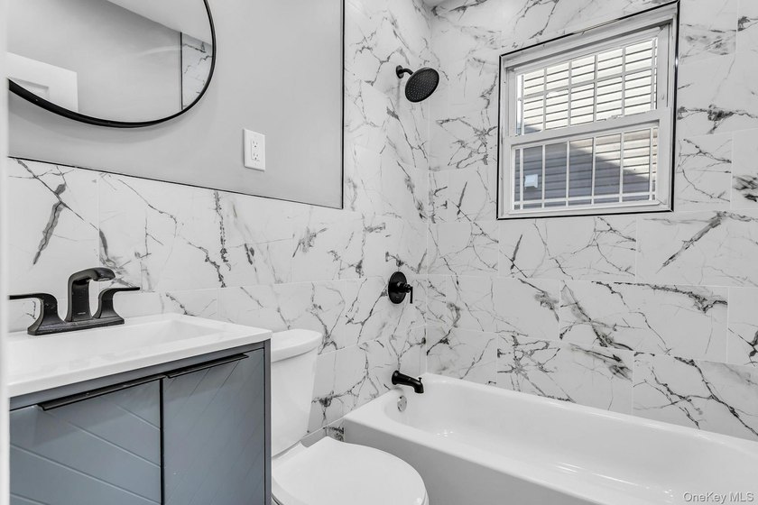 Welcome to 171-38 105 Avenue, a beautifully renovated two-family - photo 7