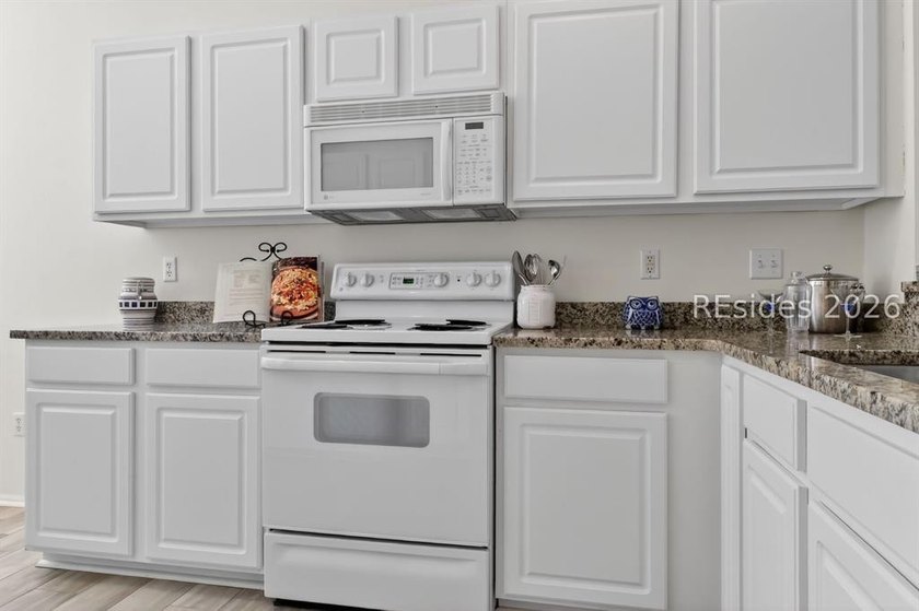 Experience the ultimate Lowcountry lifestyle in this lovingly - photo 6