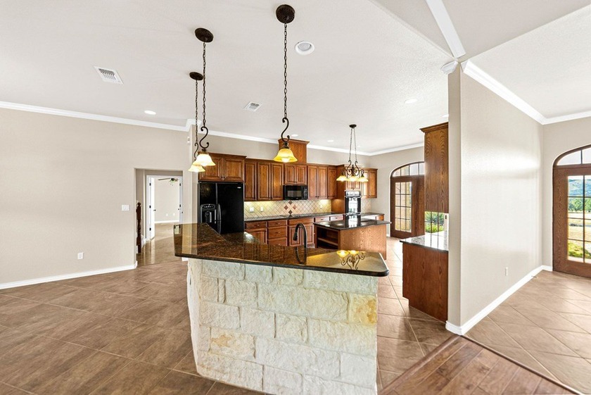Nestled in the rolling hills of the Texas Hill Country, custom - photo 13