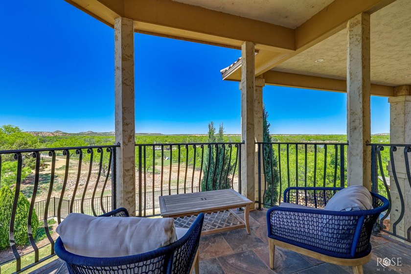Perched above the tranquil waters of Lake Nasworthy just outside - photo 44