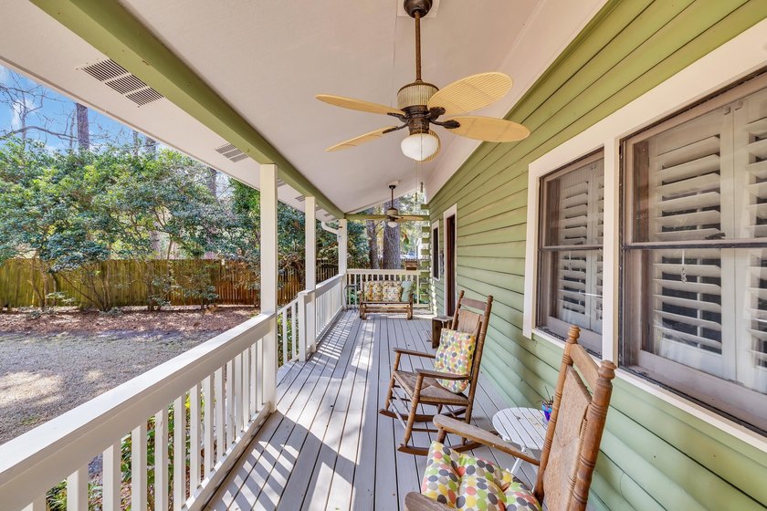 Situated beneath towering oak trees on a secluded one-acre - photo 3