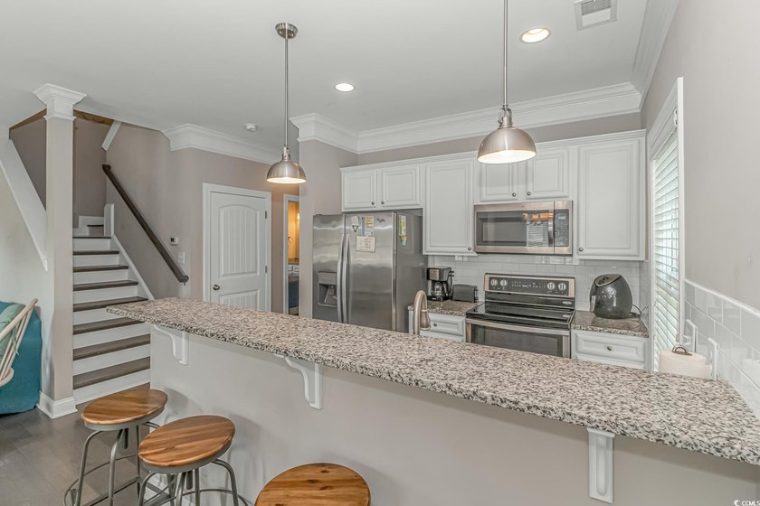 This very open and spacious 5-Bedroom, 5-Bath raised beach house - photo 12