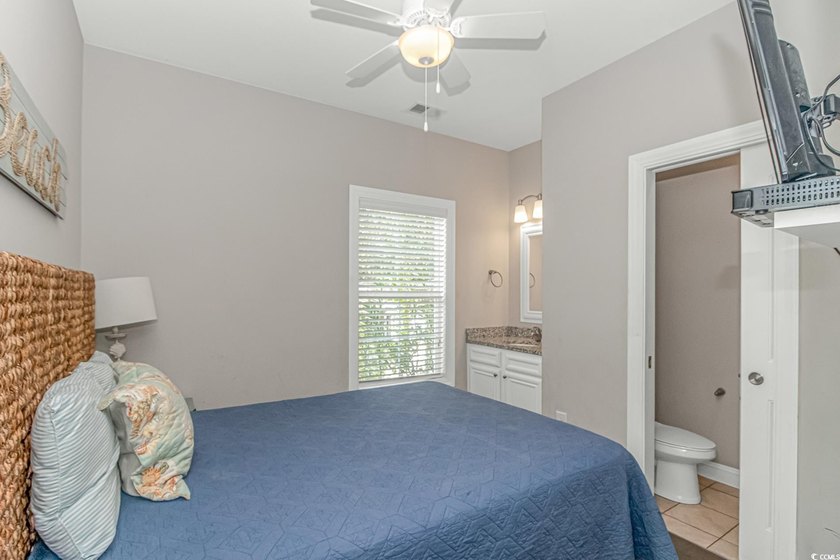 This very open and spacious 5-Bedroom, 5-Bath raised beach house - photo 13