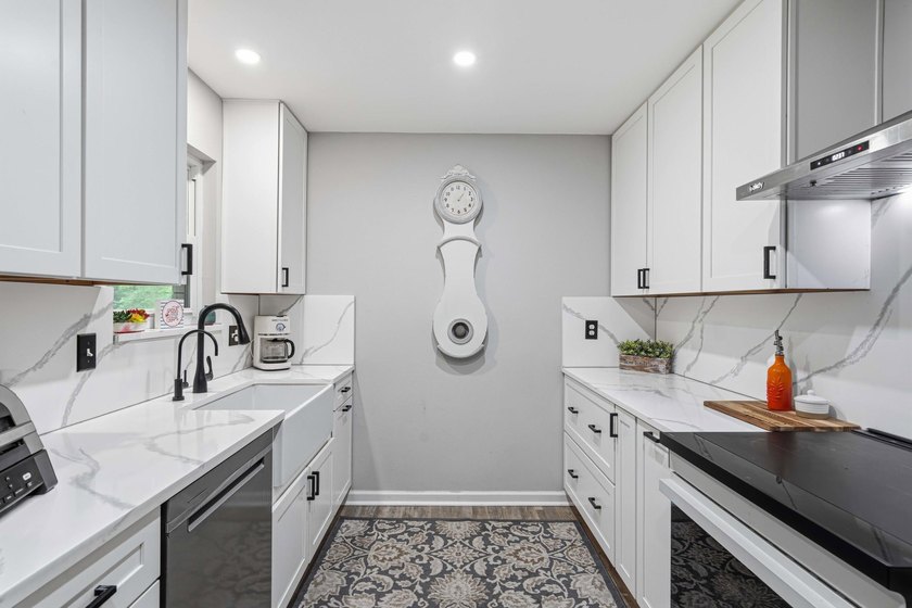 Step into a bright, split-layout ranch where the 2023 kitchen - photo 7