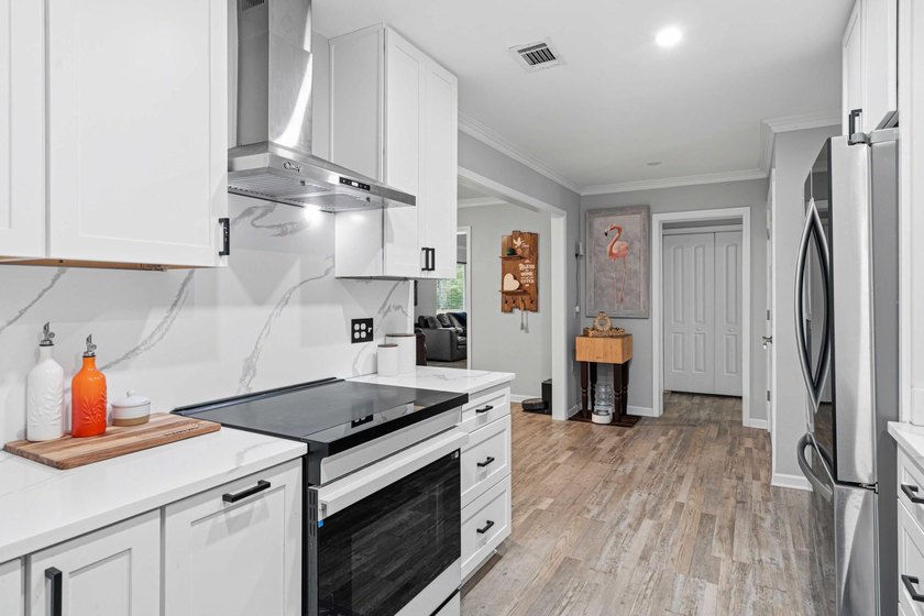Step into a bright, split-layout ranch where the 2023 kitchen - photo 8