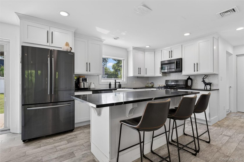 A Diamond, Completely Remodeled Colonial Located Mid-Block in - photo 7