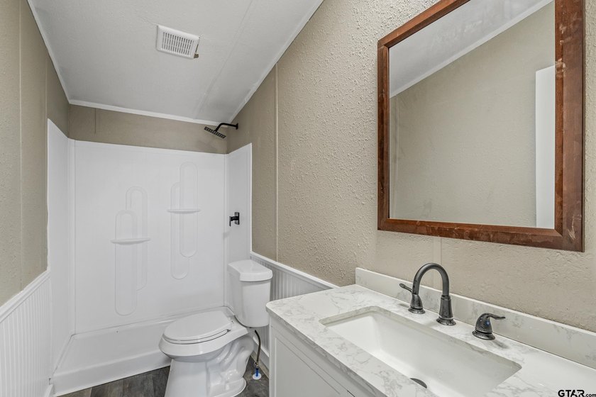 Welcome to this beautifully updated 4-bedroom, 2-bathroom mobile - photo 8