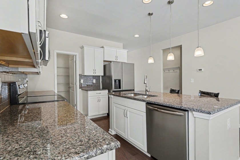 This well-designed three-bedroom, two-bathroom home features an - photo 8