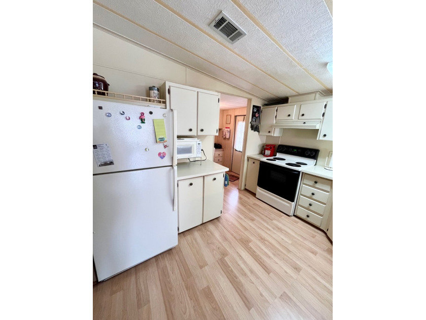 This two-bedroom, two-bath home located in the golf community of - photo 3