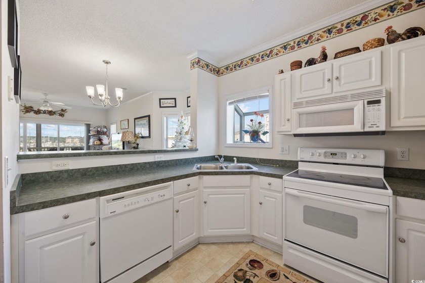 A rare opportunity to own a highly sought-after end unit in the - photo 13