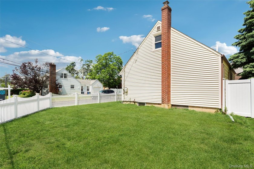Welcome to 2877 Calvin, a classic cape style residence nestled - photo 3