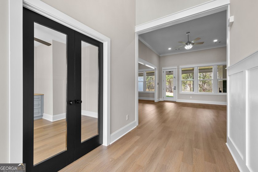 Stunning new construction overlooking a private lake, offering a - photo 9