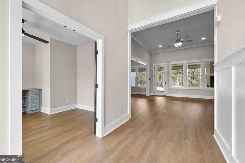 Stunning new construction overlooking a private lake, offering a - photo 10