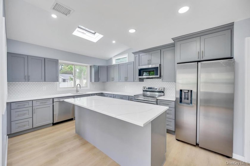 Welcome to this beautifully updated 3-bedroom, 2-bathroom Ranch - photo 8