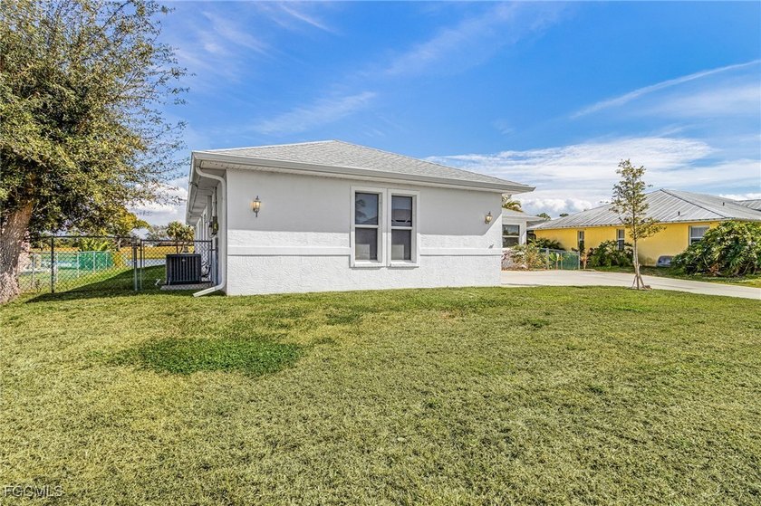 This stunning 4-bedroom, 2.5-bath waterfront pool home is - photo 3